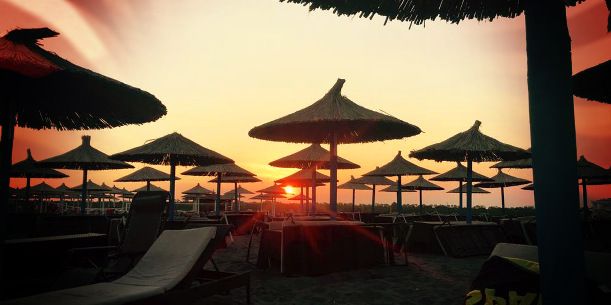 Albanian Beach Parasols and Deck Chairs at Sunrise